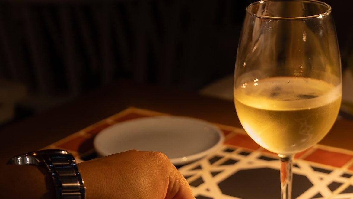 a person tasting a gourmet dish
